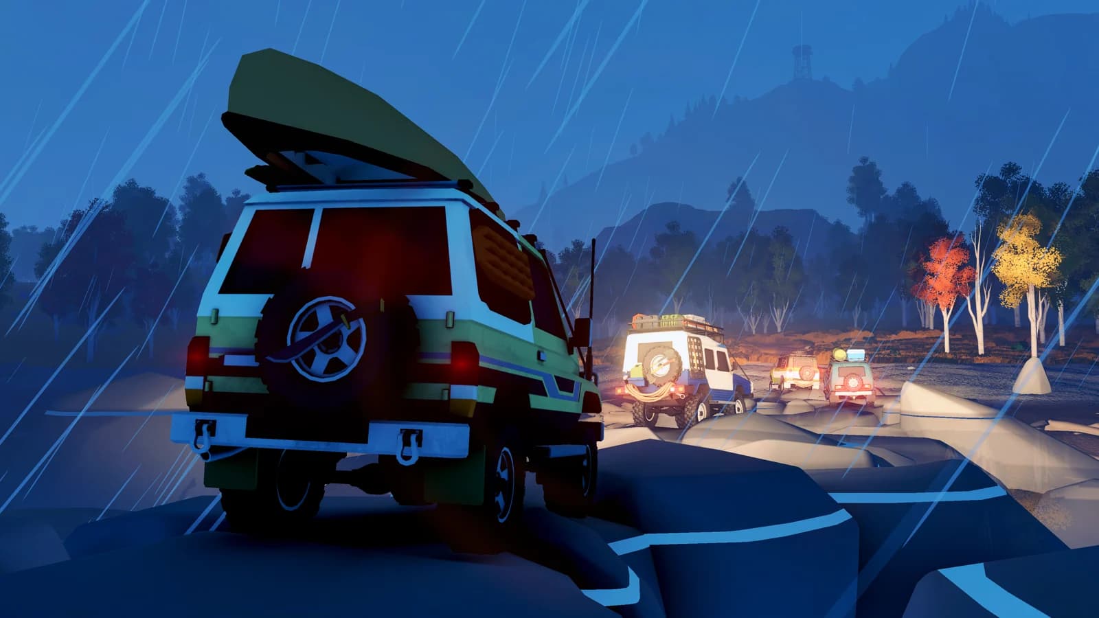 Over the Hill vehicles carrying recovery gear on a rain-soaked night drive
